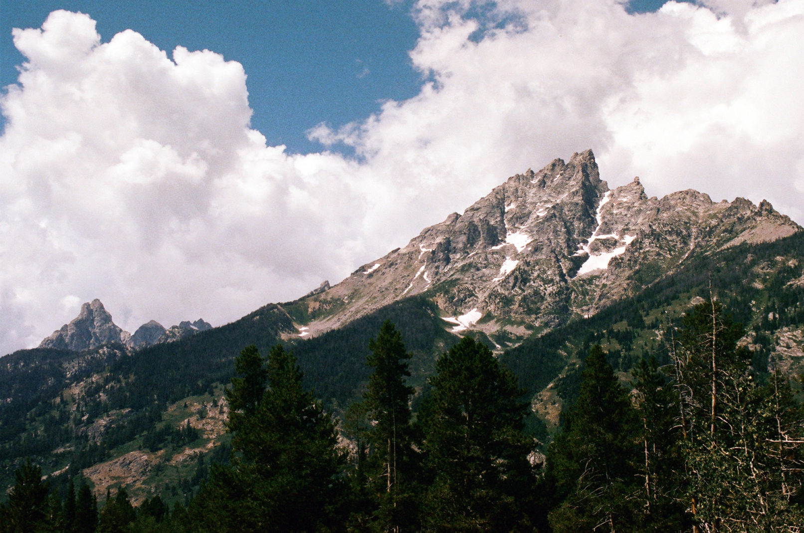 The jagged peaks of the Teton range reaching into the sky.